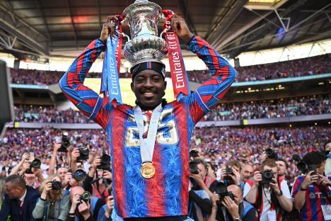 Jean-Philippe Mateta of Crystal Palace celebrates with the FA Cup trophy.