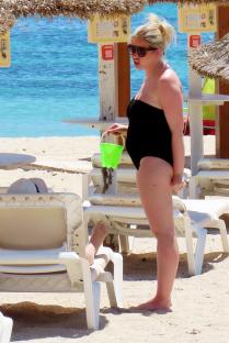 Amy Hart on a beach with her family.