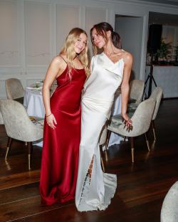 Victoria Beckham and her daughter in matching dresses.