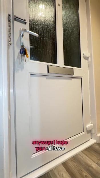 White front door with keys and a mail slot.