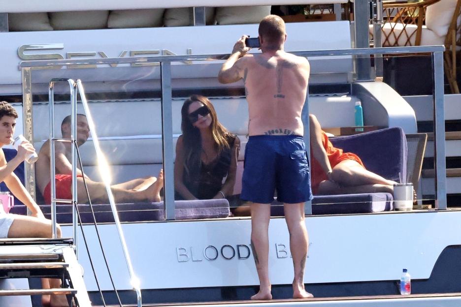 David and Victoria Beckham on a yacht with their children.