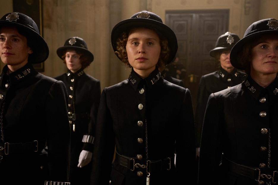 Women in police uniforms.