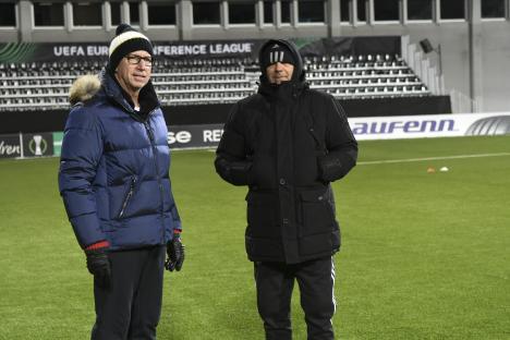 Alan Pardew and Stoycho Mladenov on a soccer field.