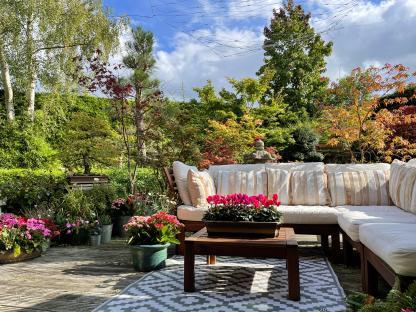 Japanese-style garden with outdoor seating area.