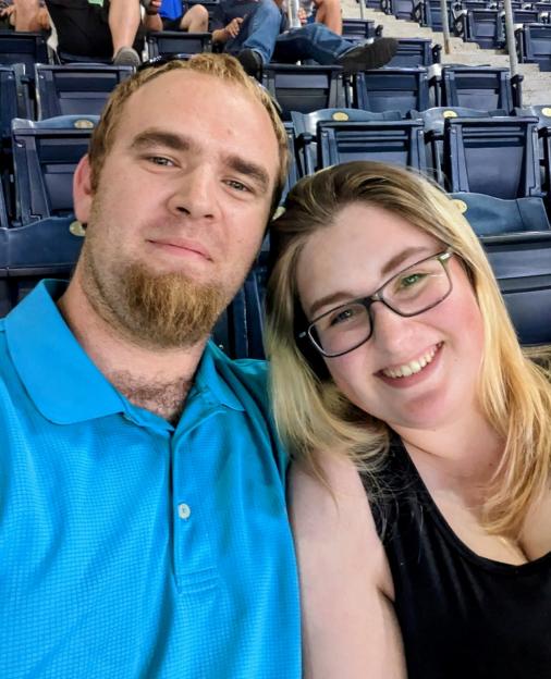Selfie of a couple at a sporting event.