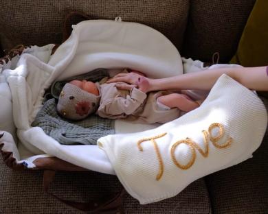 Baby Tove in a bassinet.