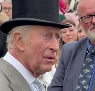 King Charles III in a top hat.