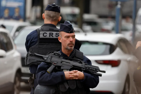 Police officer with rifle.