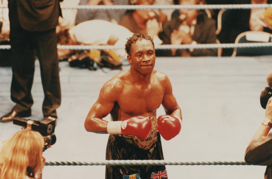 Nigel Benn in a boxing match.