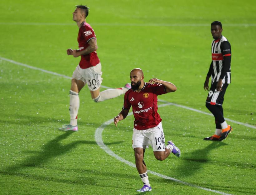 Manchester United player celebrating a goal.