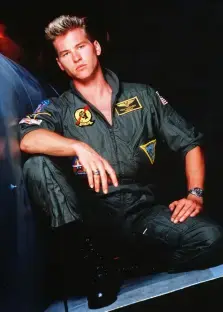 Tom Cruise in a Top Gun flight suit.