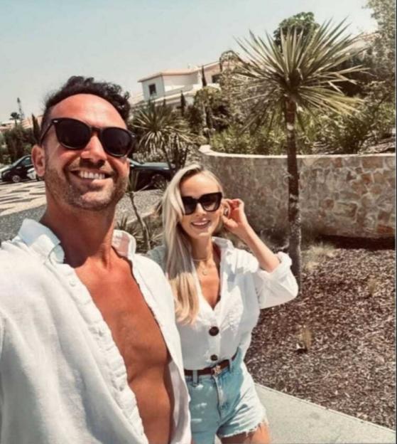 Instagram photo of a couple smiling outdoors.