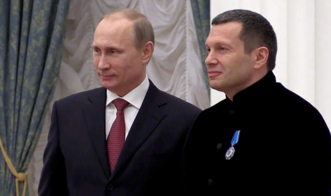 Vladimir Putin next to Russian TV host Vladimir Solovyov.