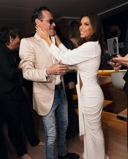 Eva Longoria embracing a man at a party in Miami.