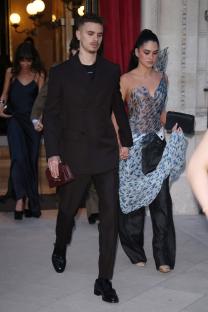 Romeo Beckham and Kim Turnbull leaving a hotel in Paris.