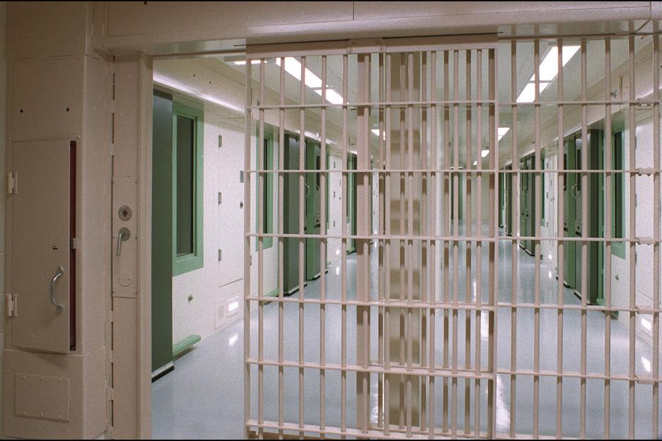 Interior view of a prison hallway.
