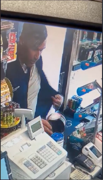 CCTV image of a man stealing a Poppy Appeal charity box.