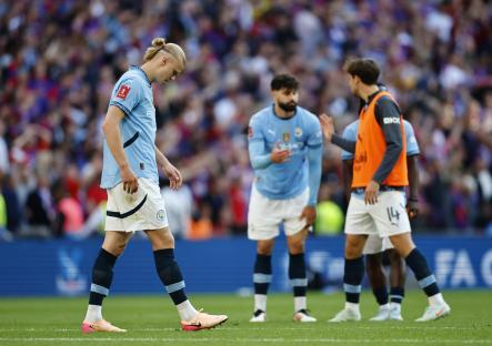 Erling Haaland looking disappointed after a soccer match.