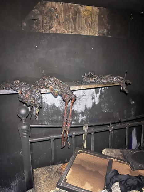 Fire-damaged bedroom after a house fire.
