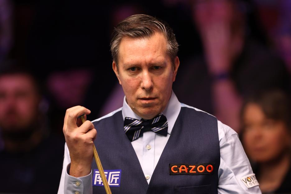 Dominic Dale chalking his cue at the World Snooker Championship.