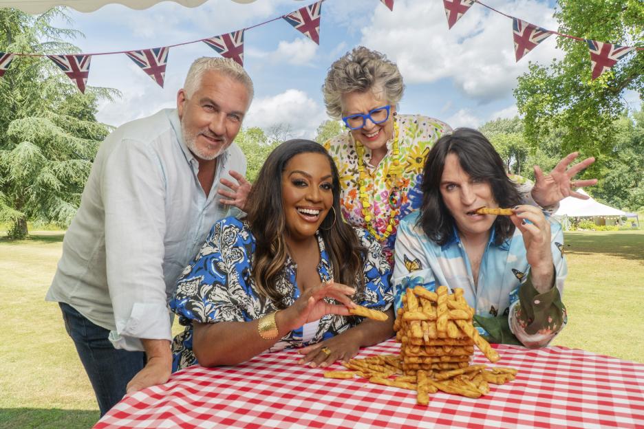 Paul Hollywood, Alison Hammond, Prue Leith, and Noel Fielding with a large pile of breadsticks.