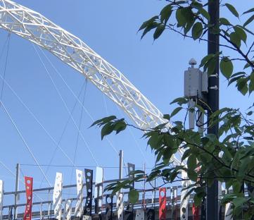 Wembley Stadium upgrade with a communications device mounted on a lamppost.