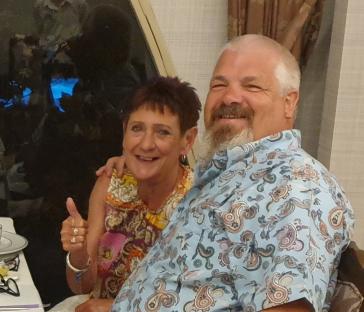 A man and woman smiling for a photo.