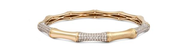 Gold bamboo bangle bracelet with diamonds.