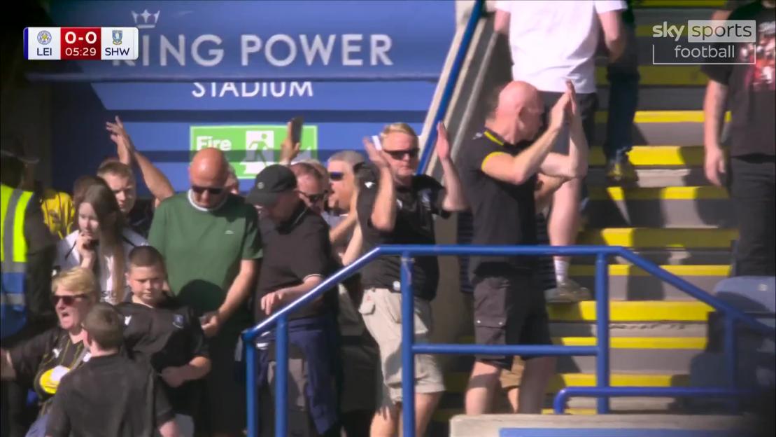 Leicester City fans applauding Sheffield Wednesday supporters.