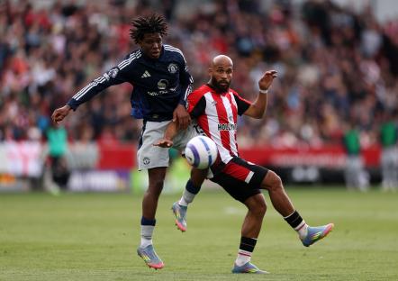 Patrick Chinazaekpere Dorgu of Manchester United battling for possession during a Premier League match.