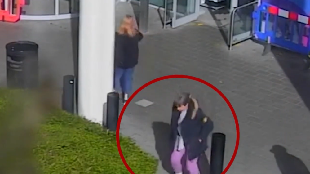CCTV image of Helen walking outside with a red circle around her.