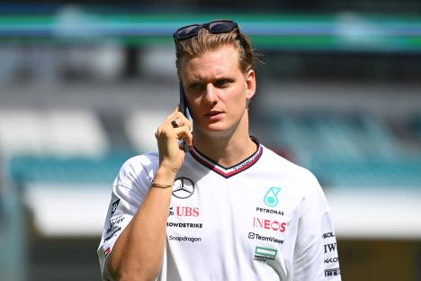 Mick Schumacher, Mercedes reserve driver, on his phone.