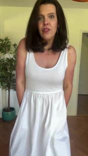 Woman in a white summer dress.