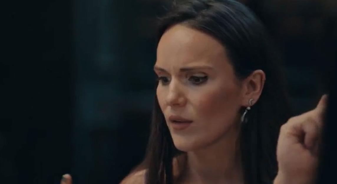 Close-up of Grace looking concerned and speaking.