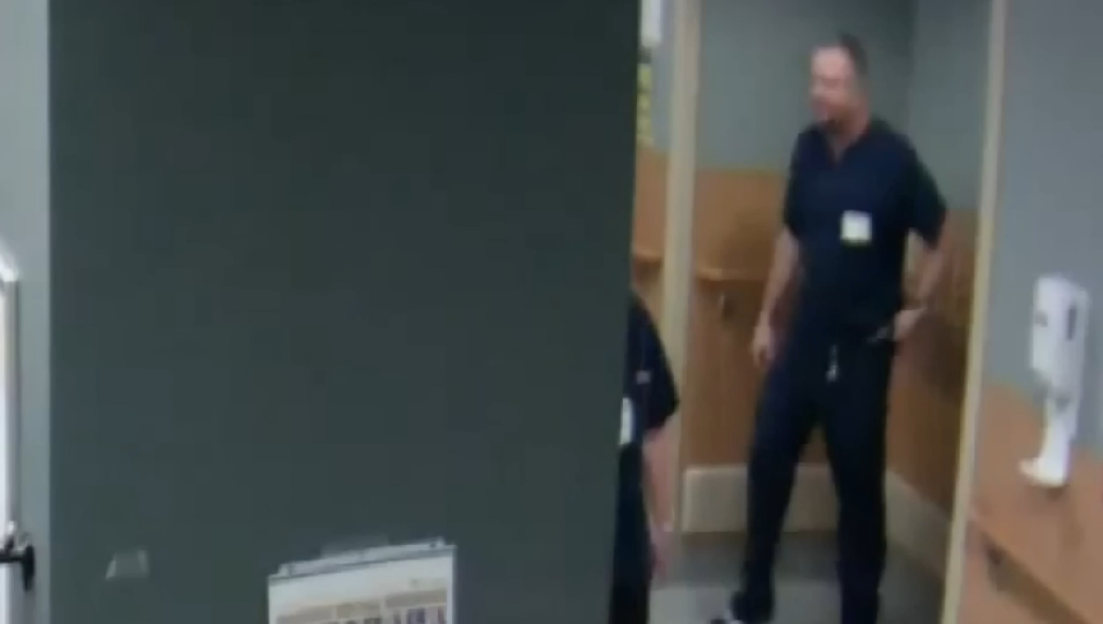 Colorado dentist James Craig wearing blue scrubs.
