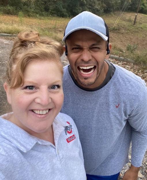 A smiling woman and man posing for a selfie.