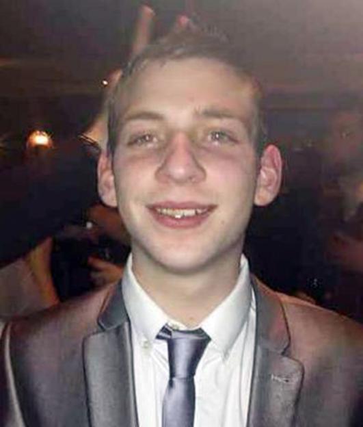 Jack Taylor, victim of Stephen Port, wearing a white shirt and grey suit jacket with a blue tie.