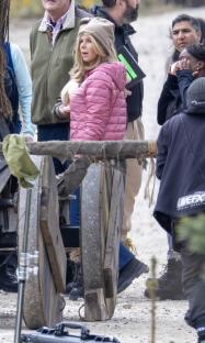 Celebrity Traitors cast filming a scene with a large Trojan horse.