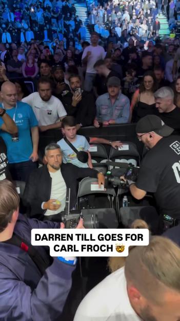 Darren Till approaching Carl Froch in a crowd.