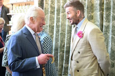 King Charles and David Beckham conversing at the RHS Chelsea Flower Show.
