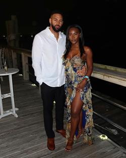 Amber Desiree Smith and Ollie Sutherland at an outdoor event.
