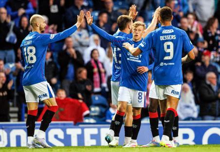 Rangers players celebrating a goal.