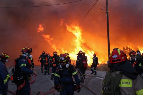 Holiday warning as wildfire is raging at Greek island forcing evacuations