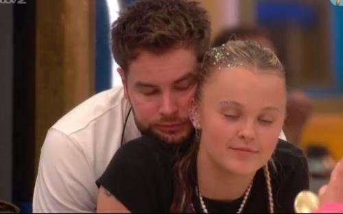 Chris Hughes embracing JoJo Siwa.