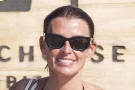 Coleen Rooney shows off her incredible abs in sea with fellow WAG on holiday with family in Ibiza