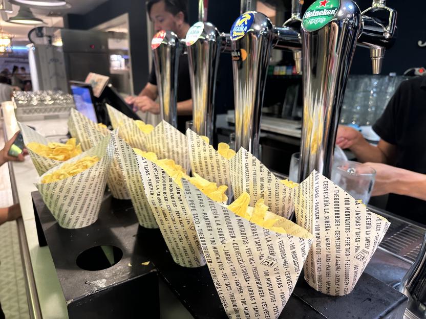 Chips in paper cups at a Spanish Wetherspoons.