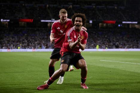 Manchester United players celebrating a goal.