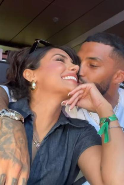 A man kissing a woman on the cheek.