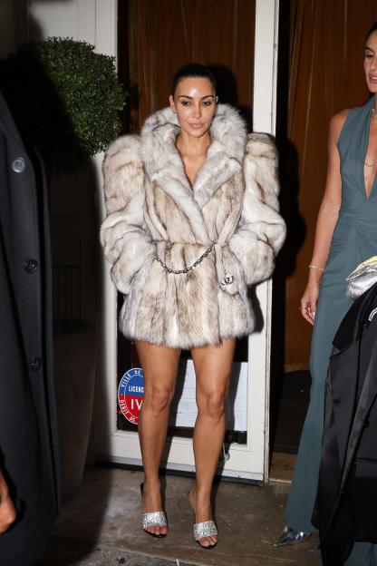 Kim Kardashian in a fur coat with a Gucci belt, in Paris.
