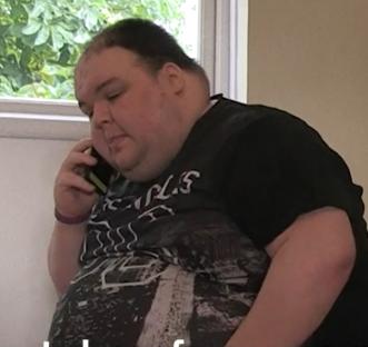 Man in Batman shirt showing significant weight loss.